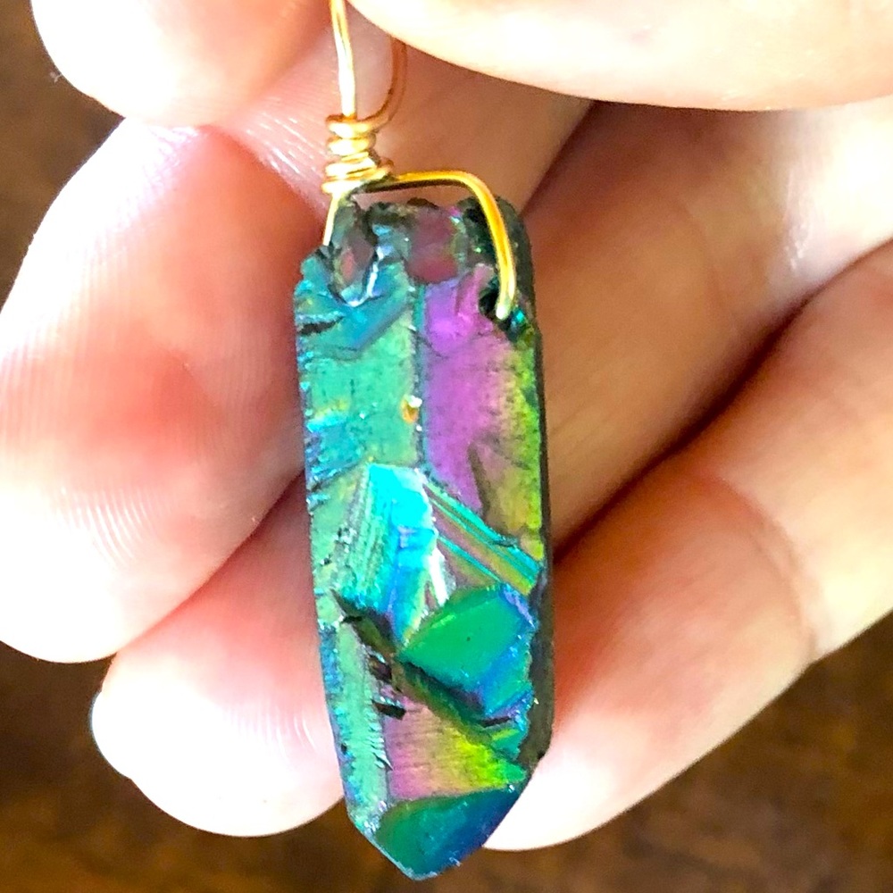 Titanium quartz and gold pendant.